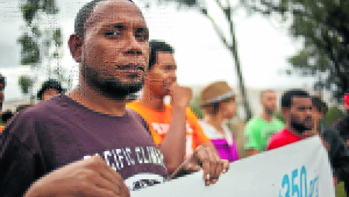 LIFE OR DEATH: Fredrick Limai, from the Solomon Islands, joins with protesters from 12 Pacific Island nations to call for an end to coalmining in the Leard State Forest.