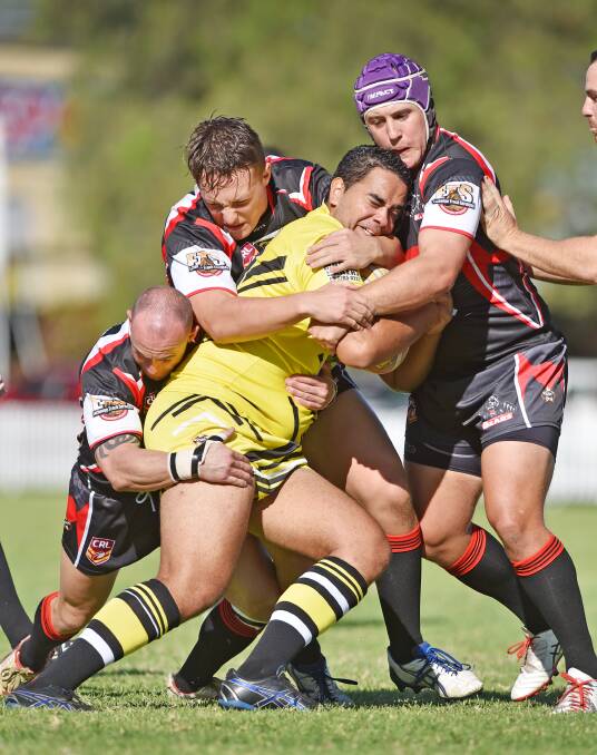 North Tamworth Bears (from left) Nick Dobson, James Cooper and Zac Russ combine to stop Oxley Diggers prop Tom Flanders in Saturday's 70-18 win at Jack Woolaston Oval. Photo: Barry Smith 110415BSD02