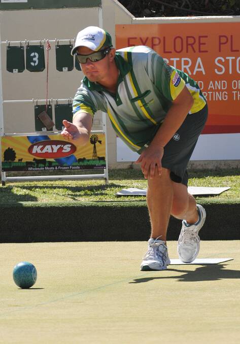 Wagga Rules Club’s David Ferguson on his way to a second Easter Singles title on the  Max Stewart Green yesterday. Photo: Geoff O’Neill 210414GOB04
