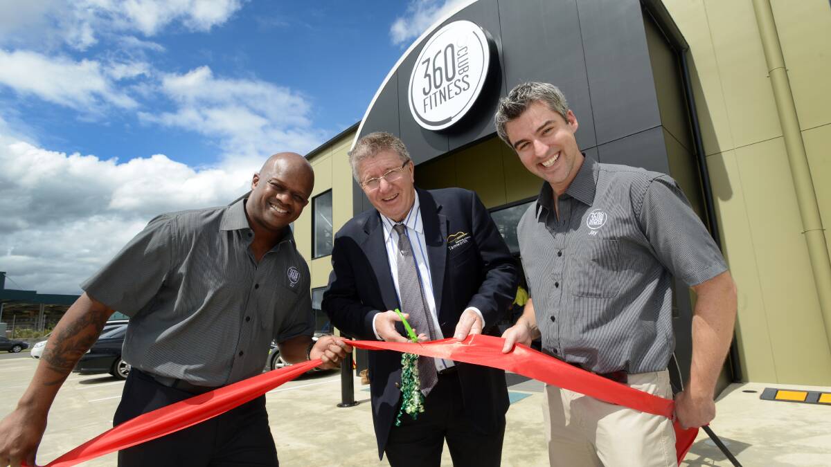 COME ON IN: Mayor Col Murray cut the ribbon to open the new 360 Fitness Club, with owners Dwone Jones, left, and Jay Lynch. Photo: Gareth Gardner 280314GGC01
