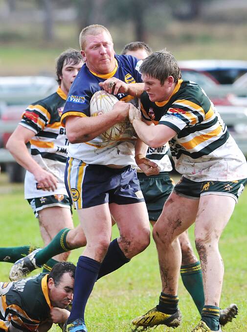 LEFT: Ben Tongue leaves Lachlan Laurie behind him as he hits Walcha’s Jack Abraham in Dungowan’s win at home on Saturday. Photo: Geoff O’Neill 280614GOG09