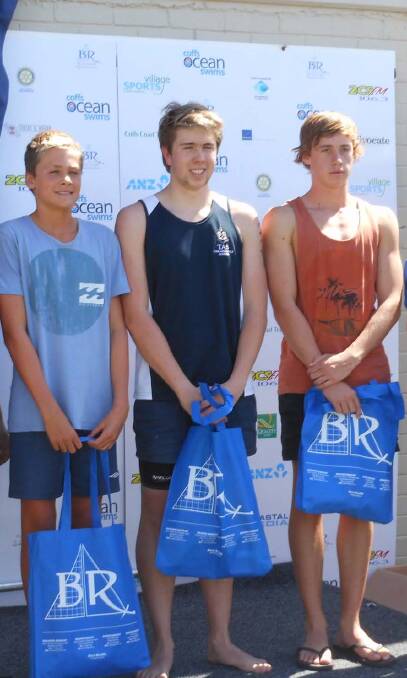 Jay Kennedy (centre) from TAS placed third in the 2km Coffs Harbour ocean swim on the weekend. 