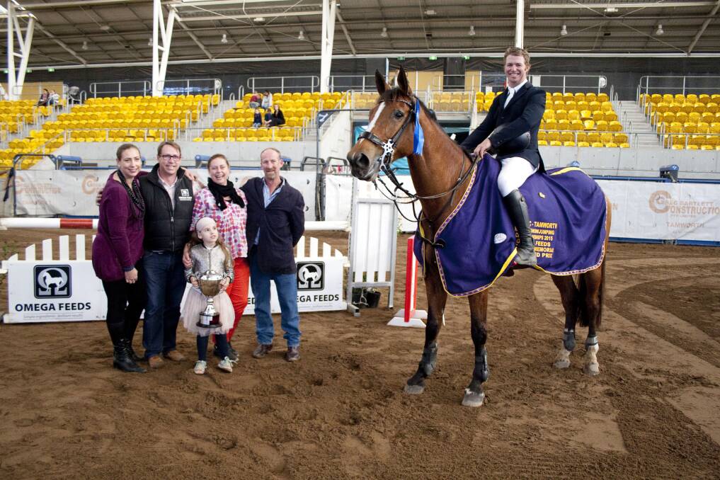David Cameron and RR Dyranta (right) won the Sue Alden Memorial Grand Prix sponsored by Omega Feeds. Sue Alden’s family, Kate, Dave, Sally and Adam were at the event to present the trophy to the winner of their mother’s memorial class. Photo:  Furdography
