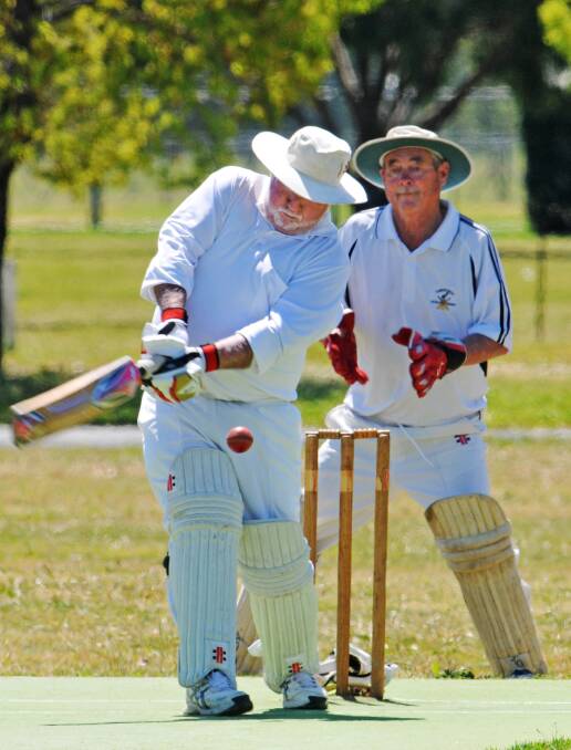  Arthur Yates swings at his delivery during a recent vet trial in Sydney. He and wicketkeeper, Grahame Davies, will be padding up for the Tamworth Golds when they take part in this week’s NSW O60 Carnival in Armidale. Their Blues have a first-round bye today. Photo: Geoff O’Neill 280914GOB02