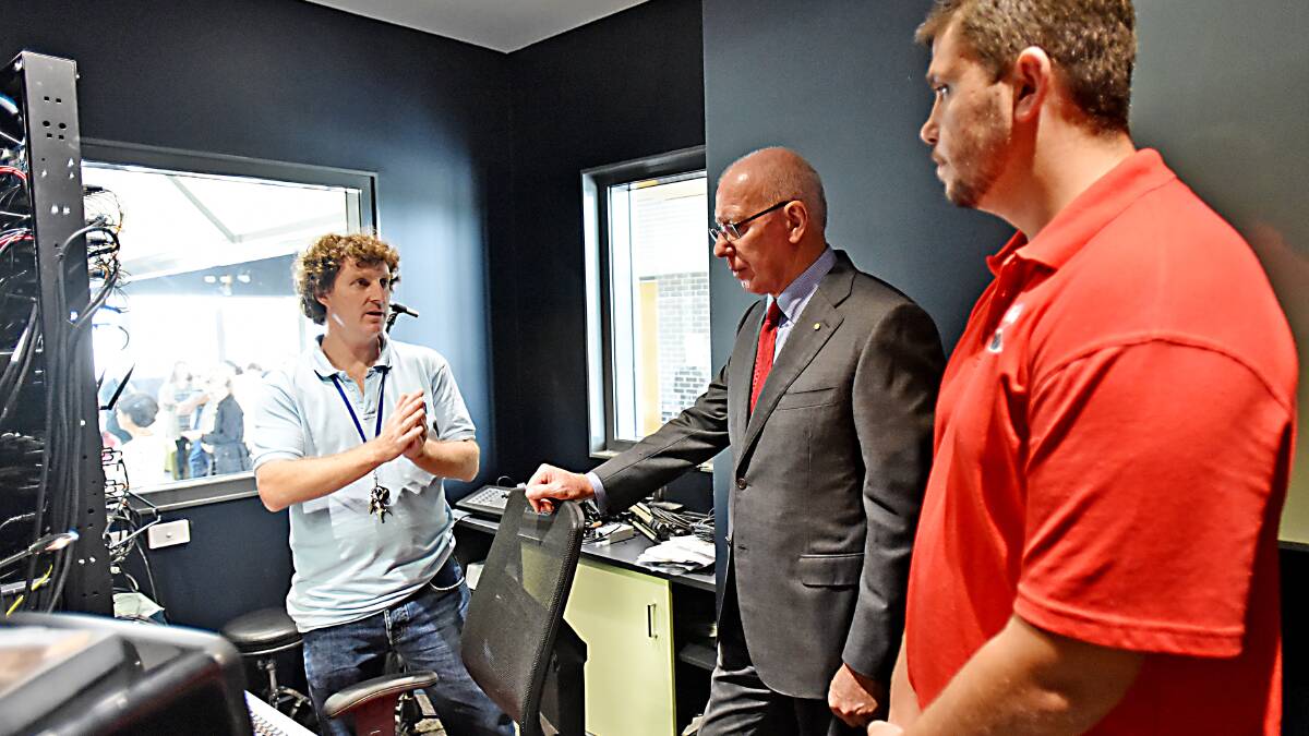 REGAL TOUR: Youth services co-ordinator Steve Blanch shows NSW Governor, General David Hurley the ropes of Tamworth’s Youth Centre with Aboriginal youth worker Marc Sutherland. Photo: Geoff O’Neill 