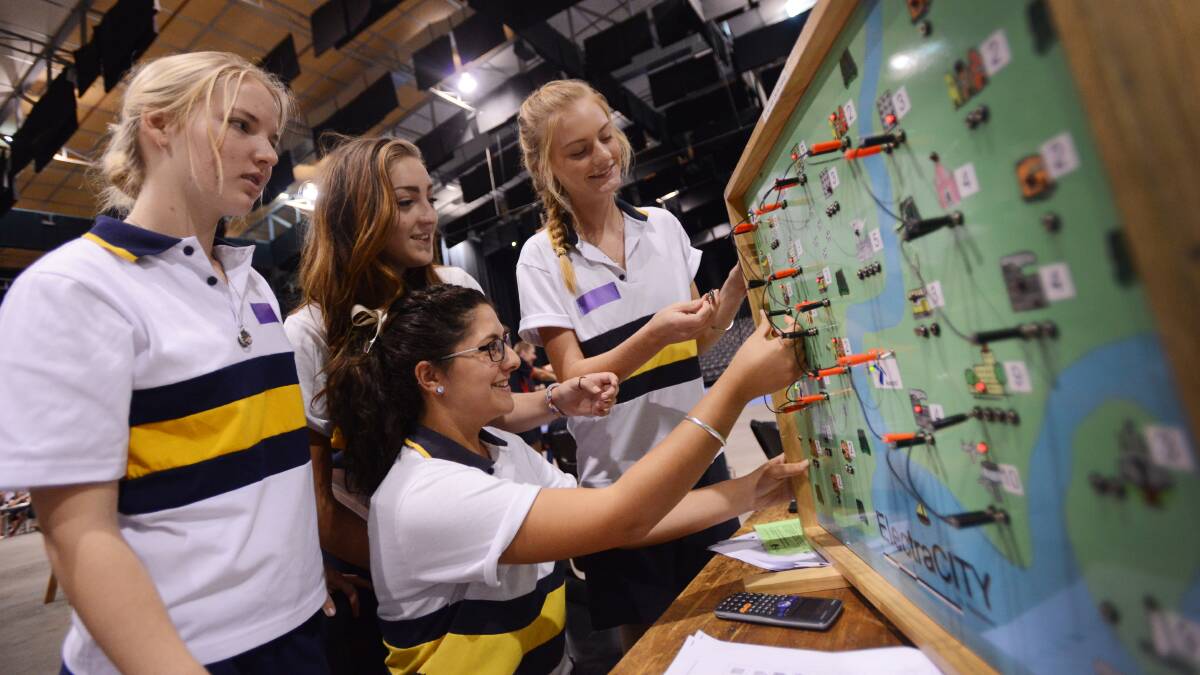 POWERING UP: Back left to right, McCarthy Catholic College students, Finlae Evans, Amber Fisher and Bronte Ellicott, with Sara Awad, at front, try to optimise electricity distribution during last week’s science and engineering challenge. Photos: Gareth Gardner 190314GGB11