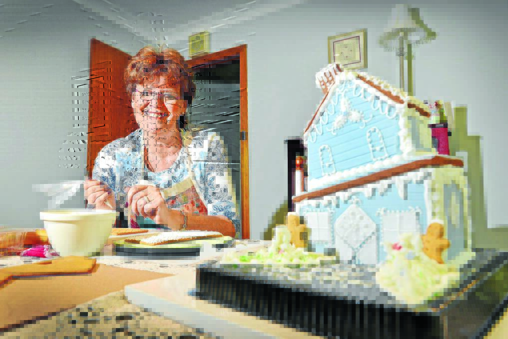 ICING ON THE HOUSE: Robyn Campanelli is trying her hand at gingerbread houses this Christmas, with the European tradition becoming increasingly popular among locals. Photo: Barry Smith 191214BSA03