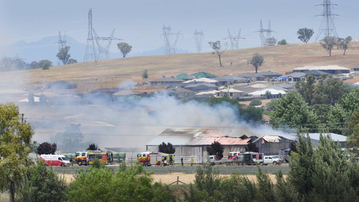 LEFT – SHED FIRE: Fire crews at work on a property near King George V Avenue  Photo: Gareth Gardner 241114GGB02