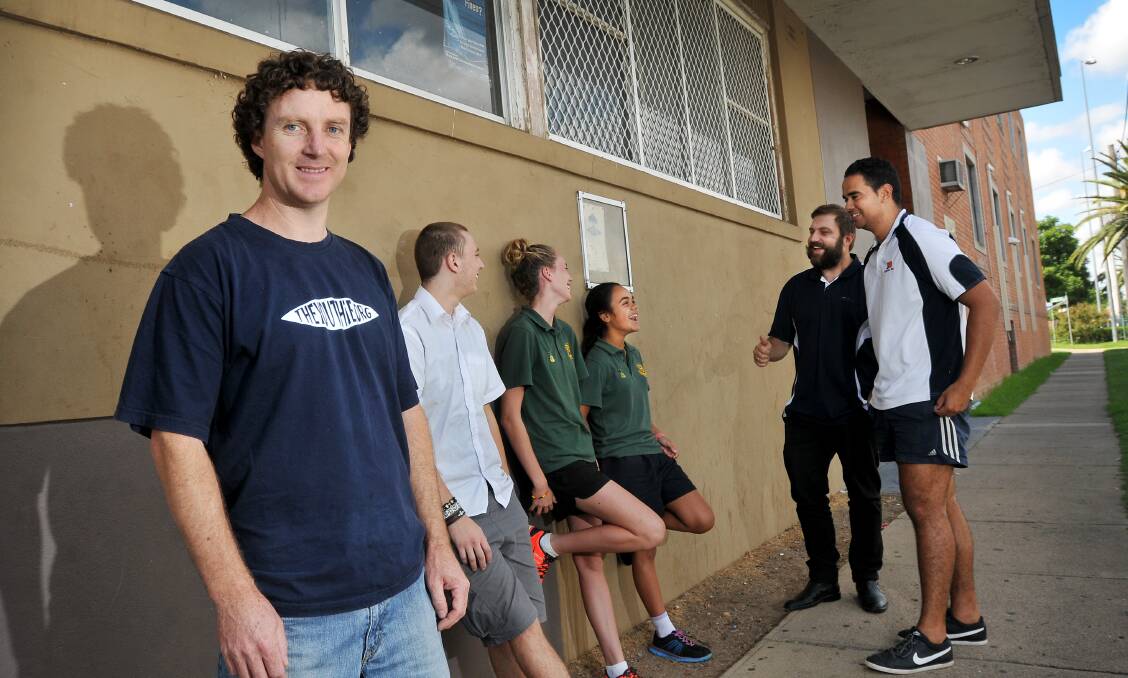 HAVE YOUR SAY: Stephen Blanch, Kaleb Miller, Paris Knox, Janaya Lamb, Dan Wilson and Tom Flanders discuss plans for the new Coledale youth centre outside The Youthie yesterday. Photo: Gareth Gardner 020414GGC01