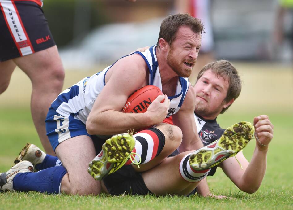 Tamworth Kangaroo Chris Pollock gives a one-eyed barometric reading of this play for Inverell’s Sam Kimmence in their recent clash. Pollock is a key man again today when the New England Nomads come calling. Photo: Barry Smith 300515BSD40