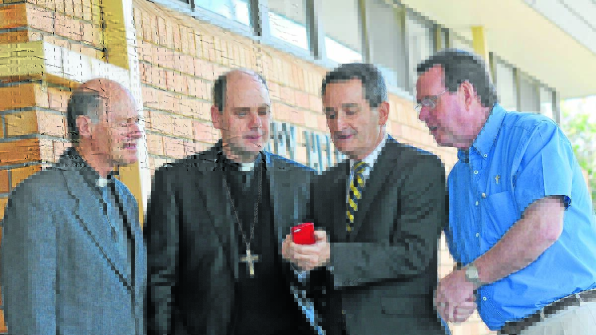 TIME FOR CHANGE: From left, Monsignor Ted Wilkes, Bishop Michael Kennedy, Francis Sullivan and Father John McHugh after yesterday’s meeting in Tamworth. Photo: Gareth Gardner 170914GGD01