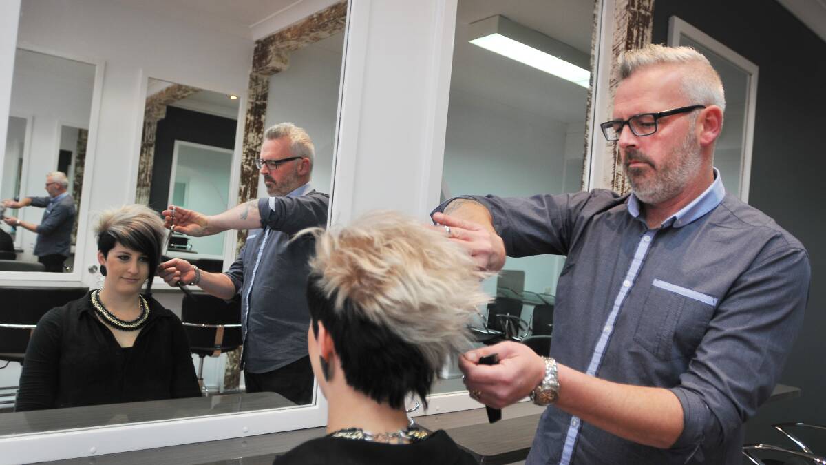 No CUTTING CORNERS: Ben McLeod has done a three-point turn in his career from hairdresser to truckie and back again. He’s pictured here with fellow hairdresser Katie Ireland. Photo: Gareth Gardner 040814GGA01