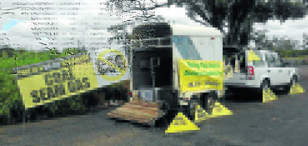 HONKING SUPPORT: Local residents joined a statewide demonstration against coal seam gas yesterday, setting up shop on the side of the Newell Highway from Coonabarabran to Moree. Photo: Kim Revell