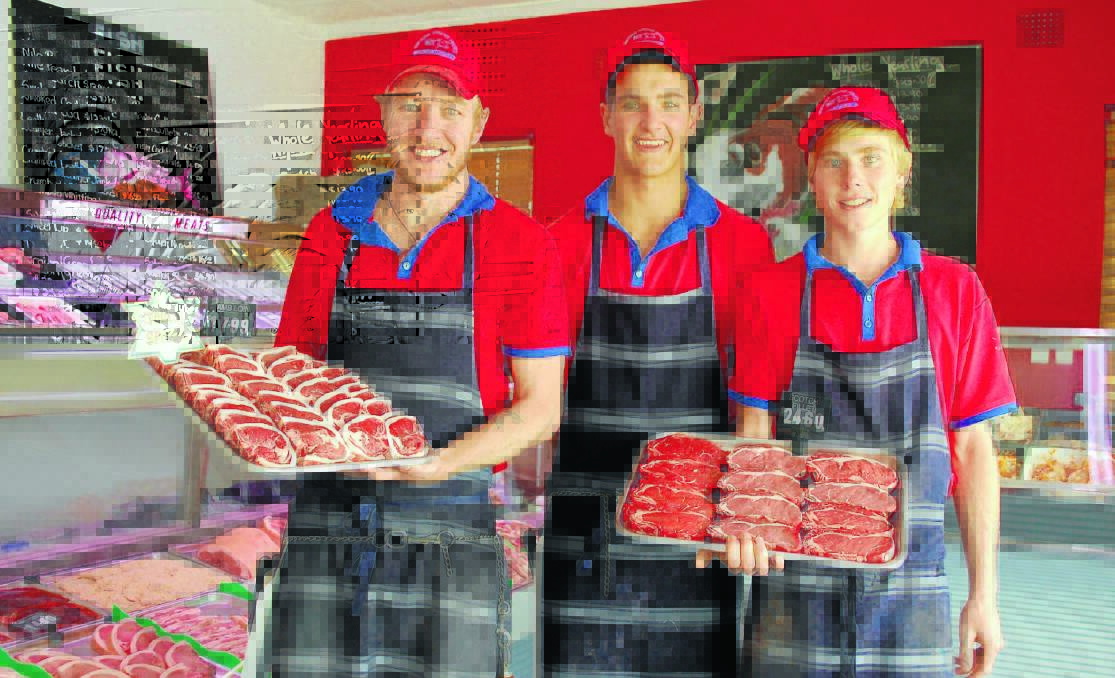 PRIME TIME: Walcha Prime Meats staff Jonathon Cross, Tom Boyd and Willie Wicks showcase some of the shop’s renowned lamb and beef. The 
butcher was featured on Tuesday night’s episode of My Kitchen Rules. Photo: Walcha News