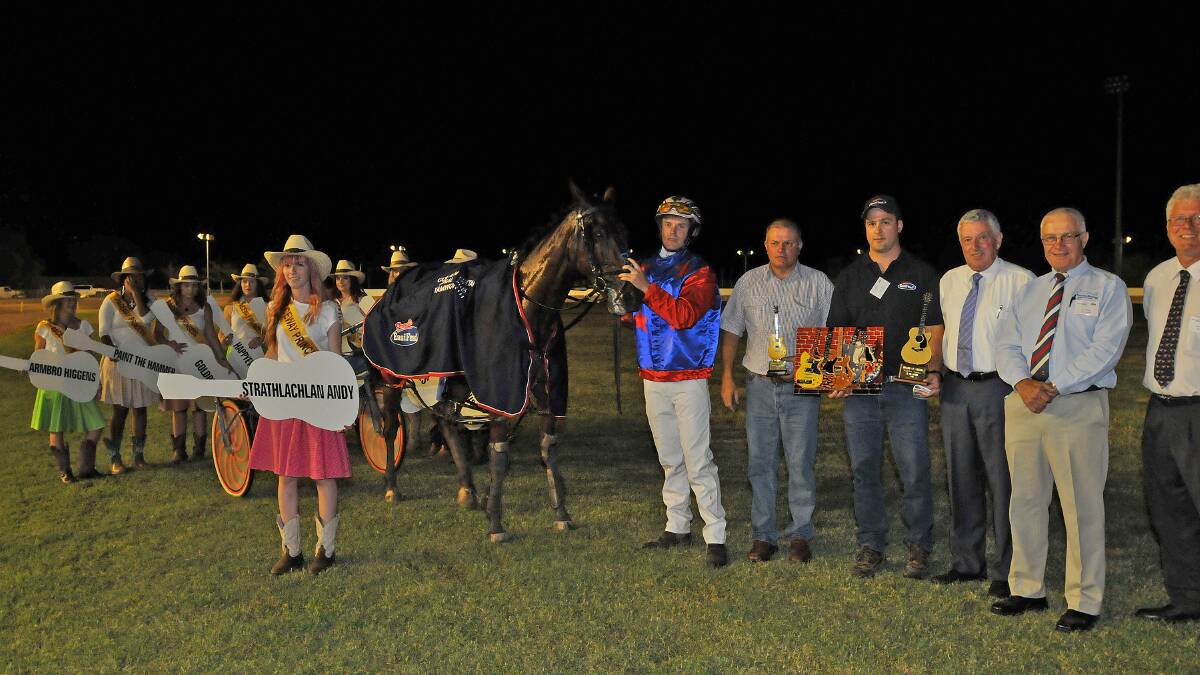 Golden Guitar winner Strathlachlan Andy with Paceway Princess Jess Mitchell, winning driver Matt Harding and (from his left)  trainer Geoff Harding, Pryde’s EasiFeed sponsor Matt Pryde, Harness Racing Authority directors Rod Smith and Chris Edwards and Tamworth chairman Terry Browne. Photo: Geoff O’Neill 230115GOE03