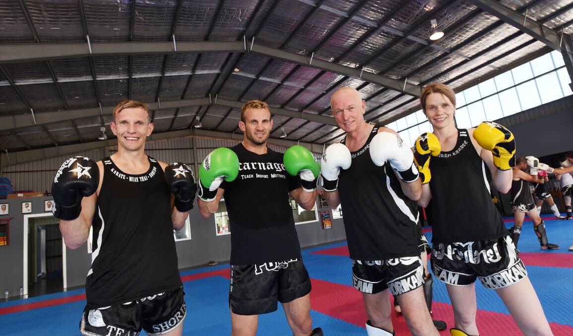 Chaffey’s Blackbelt Academy hosted a visit from Nathan ‘Carnage’ Corbett (second from left). He’s with  (from left) Scott Chaffey, Clint Chaffey and Kristie Chaffey. Photo: Gareth Gardner 070215GGG02