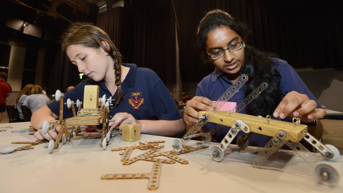 SCIENCE NUTS: Oxley High's Gabrielle Deweger, left, and Chris Felix concentrate as they piece together their Mars rovers at the science and engineering challenge at TRECC yesterday.  Photo: Gareth Gardner 190314GGB08