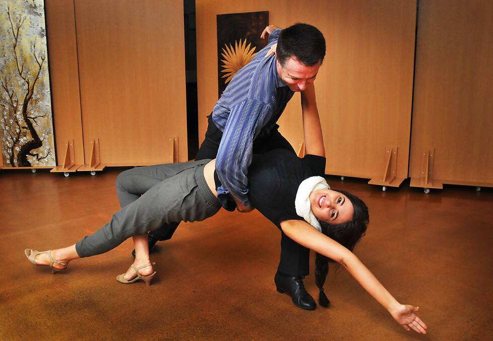 PRACTICE MAKES PERFECT: Radio announcer Crystal Vas and partner Peter Kaluder will be dancing for charity next week. Photo: Geoff O’Neill 020614GOC01