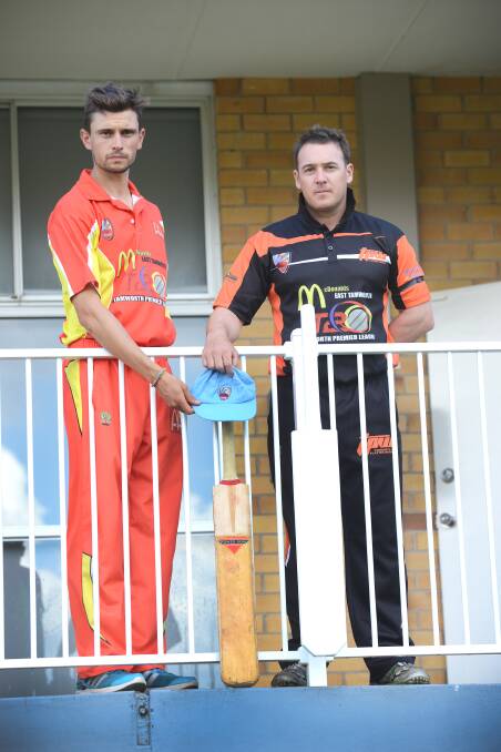 Rival captains Adam Mansfield (McDonald’s, left) and Adam Jones (Tamworth Plaster Works Tigers) put a bat out for Phillip Hughes. Photo: Barry Smith 281114BSD04