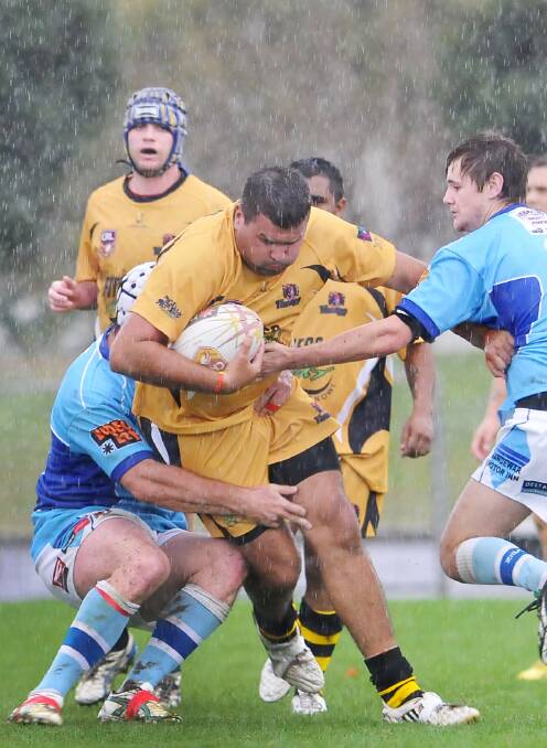 Oxley Diggers prop Damien Allan tries to crash his way through the Narrabri defence in  yesterday’s rain-marred Group 4 match at Scully Park. 
Photo: Gareth Gardner  010614GGE03