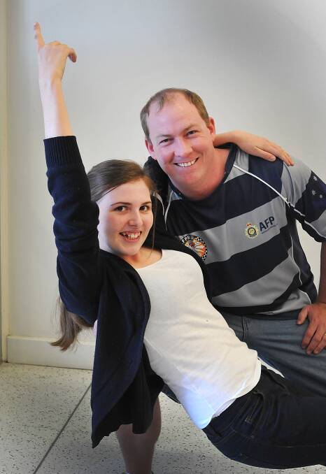 Foxing ON THE FLOOR: Taylor Rains with Lachlan Stewart will dance the foxtrot to raise money for cancer. Photo: Geoff O’Neill 060614GOE01