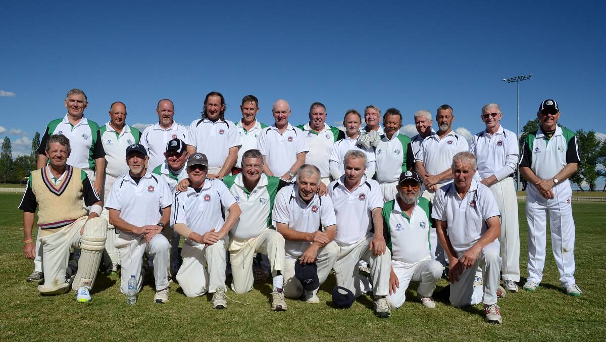 The Sydney 1's and Mid North Coast Sharks encapsulating the sportsmanship of the NSW Over 60s carnival after they clashed in the final at the Armidale Sportsground yesterday, with Sydney running out victors. Photo: www.pixonline.com