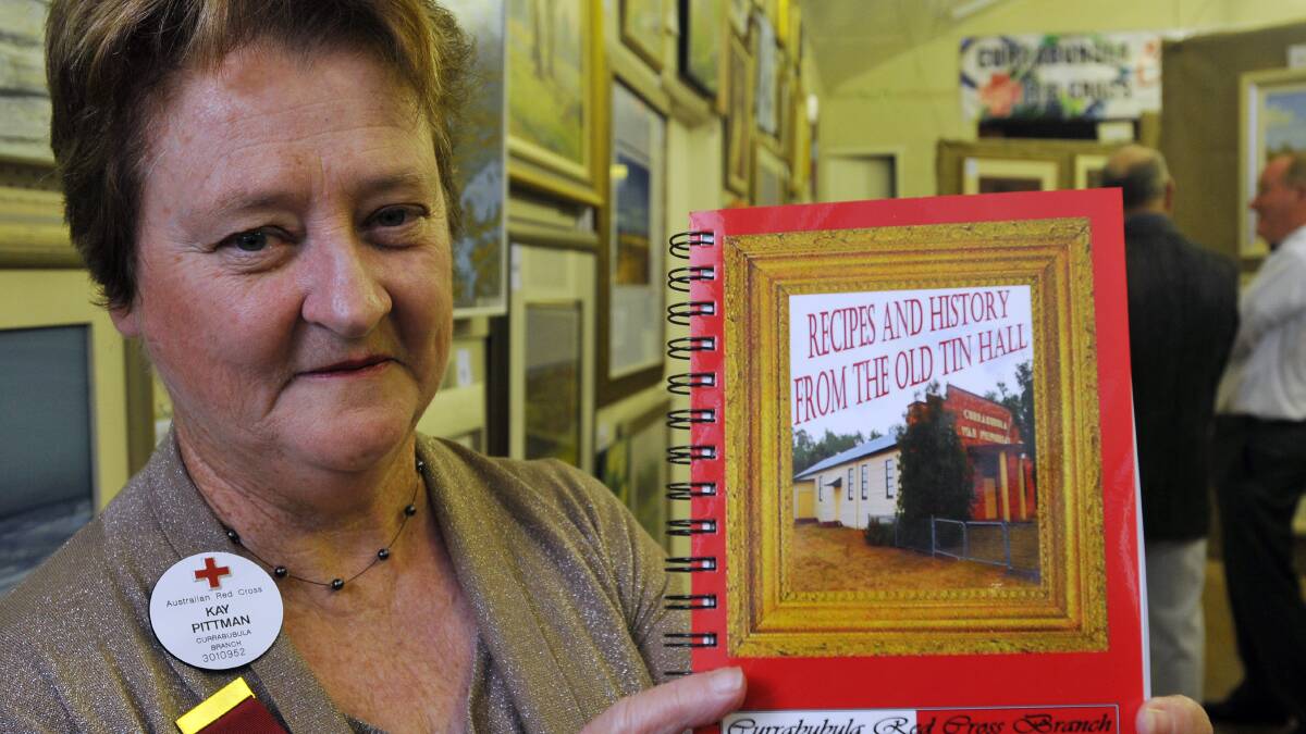 RECIPES and HISTORY: As well as artworks on sale, Recipes and History from the Old Tin Hall, a commemorative cookbook and history compiled by branch members, and shown by former president, Kay Pittman, will be available for purchase at the Currabubula Red Cross Art Exhibition. 090513GOG01