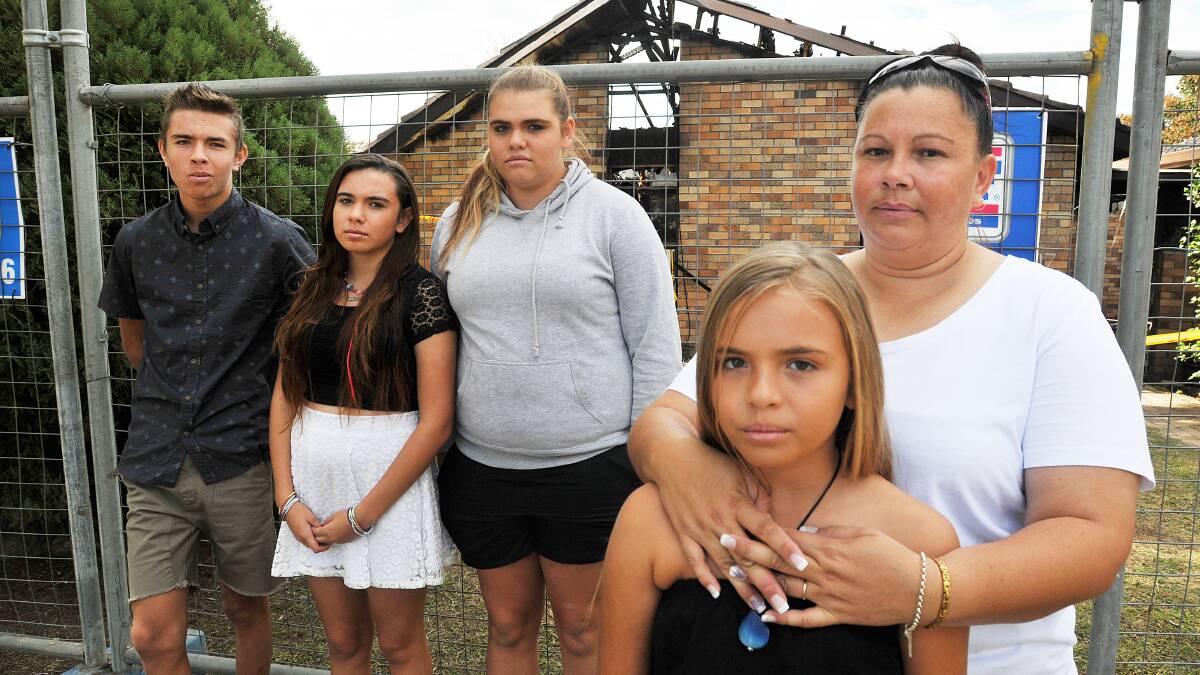 OUT OF THE ASHES: Recovering from the fire that destroyed their Doona St home at Easter are, from left, Alaijah Berry, Rheannon Berry, Bianca Berry, Tanielle Cutmore and, front, Shontaia Berry, Photo: Geoff O’Neill 250414GOD02