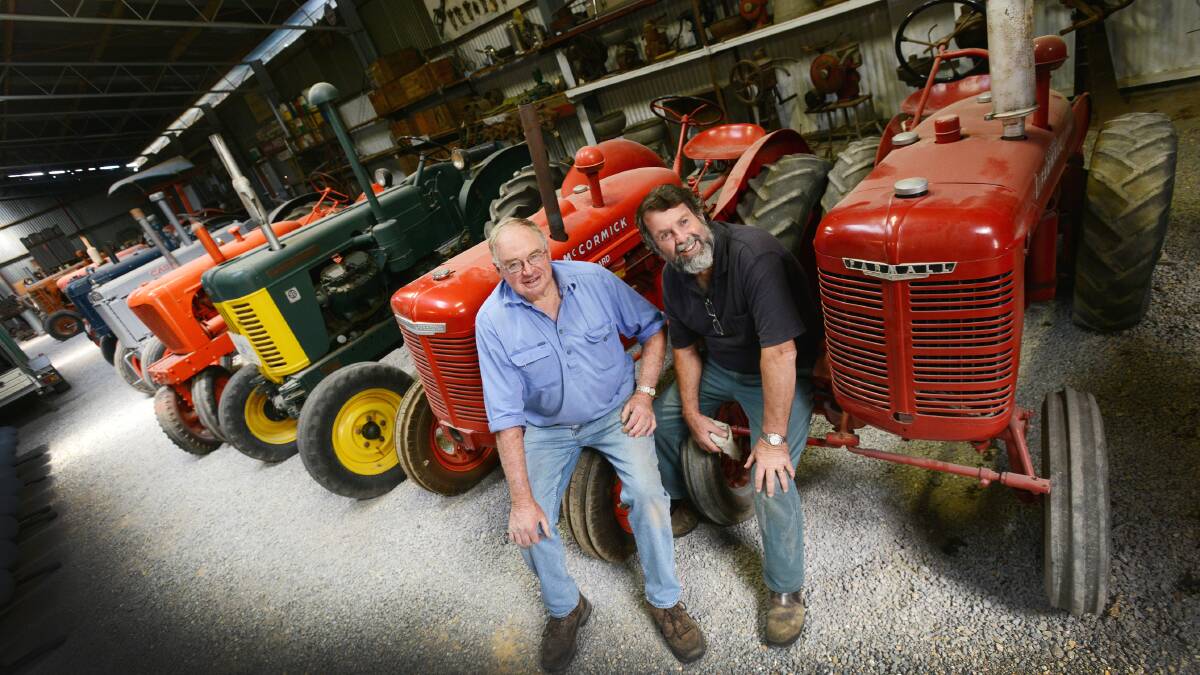 BIG WEEKEND: Quirindi Rural Heritage Village committee chairman Bob McInnes, left, and secretary Cedric Grayson with some of the machinery and items that will be on show at the annual swap meet. Photo: Barry Smith 170414BSB02