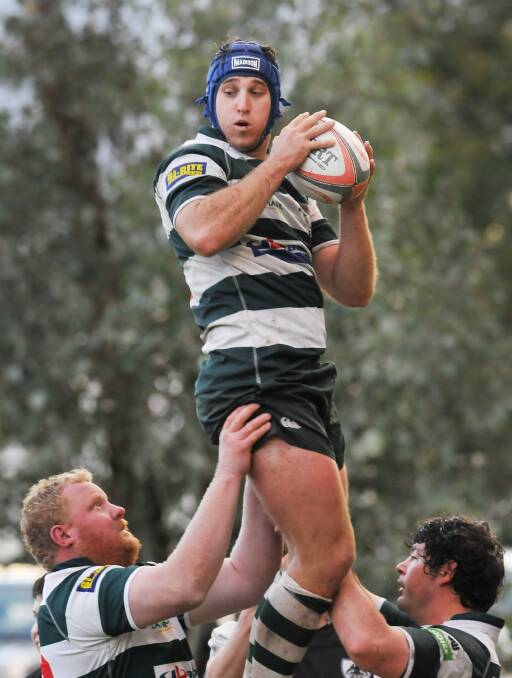 Barraba’s Adam Scanlon is lifted  to win this lineout against Tamworth on Saturday.  
Photo: Gareth Gardner 030514GGF04