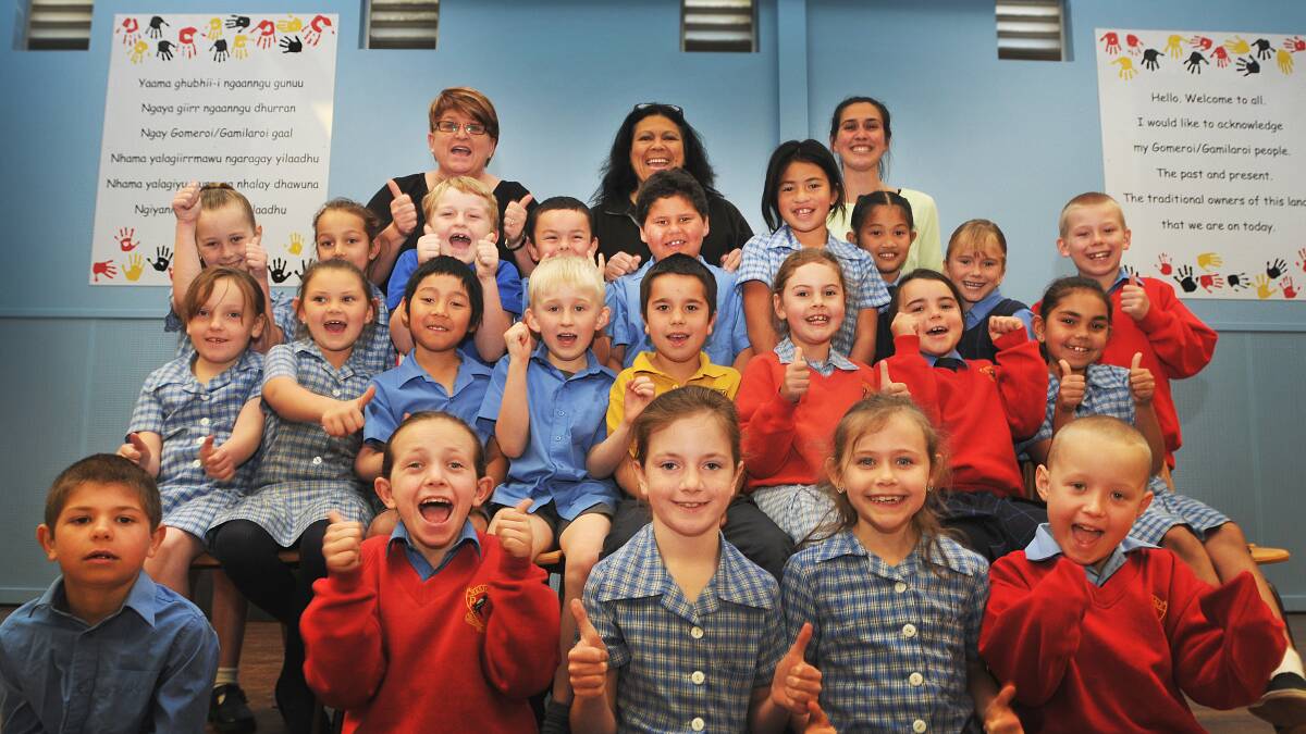 ACKNOWLEDGEMENT OF COUNTRY: Westdale class 2J celebrates their Aboriginal language and art display in the school hall, with teacher Kathie Jackson, Aboriginal education officer Julie Fuller and student teacher Stacey 
Cornish. Photo: Geoff O'Neill 110914GOC01