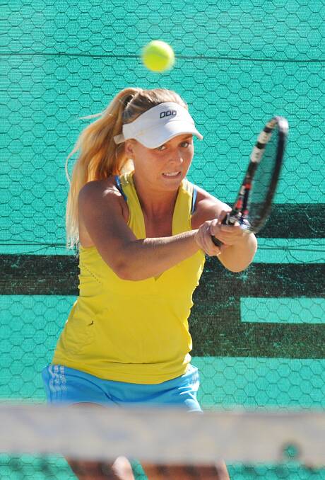 Chloe Costelloe smashes a return in the final on her way to the Tamworth Easter Open AMT singles title. Photo: Geoff O’Neill 210414GOA09