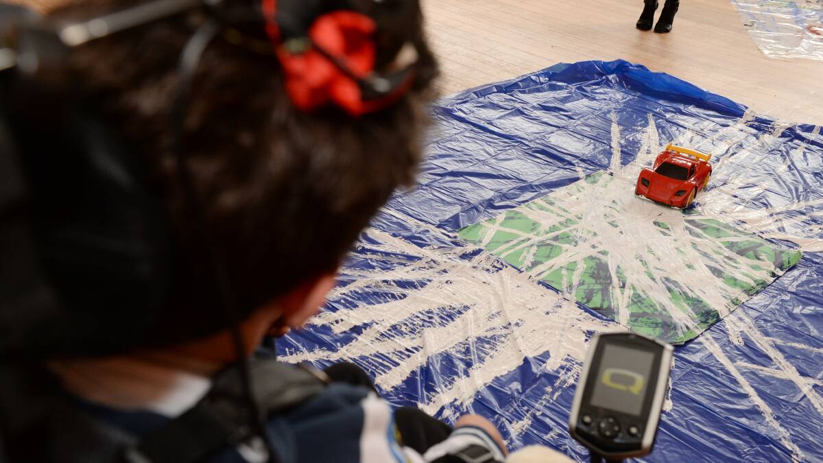 Lucas Roberts creates his art using the remote control car. PICTURE: KATE HEALY