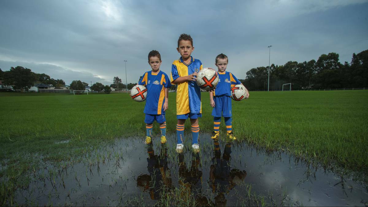 Dapto Junior FC under-7s Daniel, Cody and Finley are sad that they haven’t been able to play this season. Picture: ADAM McLEAN, Illawarra Mercury
