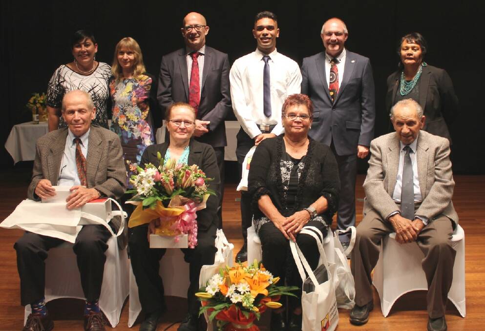 Cathy Duncan, Fiona Strang, Trevor Khan, Kyle Saunders (representing his grandfather Stan Smith), David Harris and Marion Nelio (front) with Elders award winners Peter Glennie, Linda Barnett, Zona Moore and Lloyd Benge. Photo by Raquel Clarke.