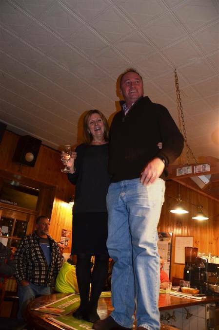 Shoes off and on the bar: Janelle Archdale and Barnaby Joyce at the Apsley Arms Hotel. Pic: Meg Francis