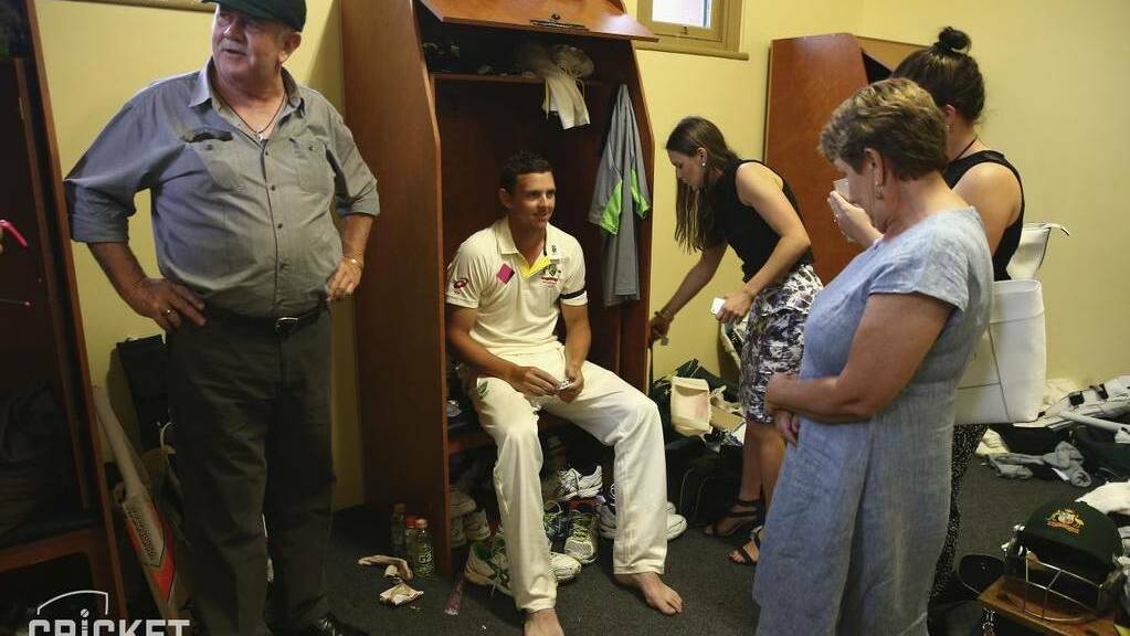 Josh Hazlewood’s father Trevor tries on his son’s baggy green as the family celebrate the end of the Josh’s second Test appearance back in January 2015. Photo: cricket.com.au