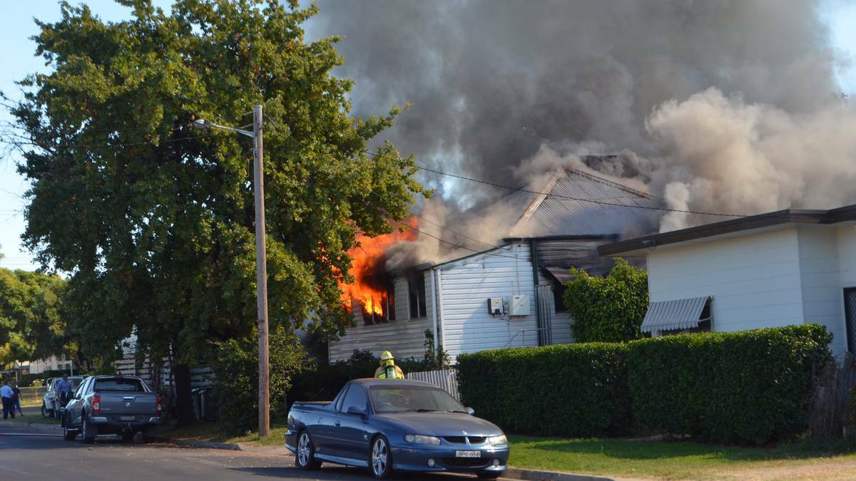 UP IN FLAMES: A family had a lucky escape after fire tore through their Iris St home in Moree yesterday morning. Photo: Moree Champion