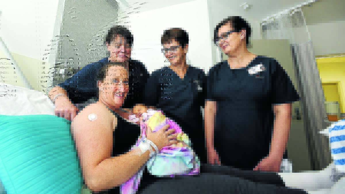 RECOGNITION:  Back from left, midwives Kelly Ison, Kim Smith and Nicole New with mother-of-four Katrina Clement with baby Isobel Clement. Photo: Gareth Gardner 020516GGD04