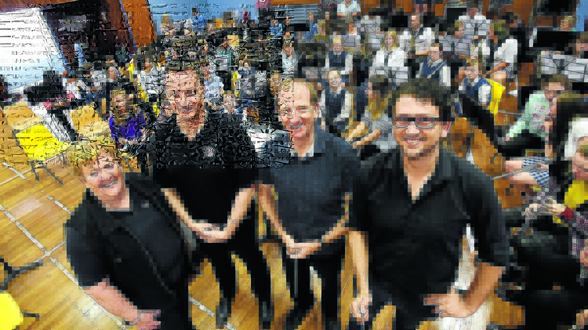 MAKING MUSIC: Di Hall and conductors Scott Ryan, Stephen Williams and Matthew Manchester with the NSW Public Schools State Wind Orchestra with regional students at the Tamworth High School workshop. Photo: Gareth Gardner 050516GGB01