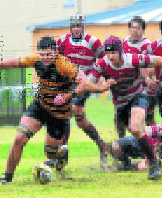 The race is on between Pirates' second rower Jason Gagnier (left) and Walcha’s Simon Newton during their wet last round clash.  
Photo: Gareth Gardner 040616GGH25
