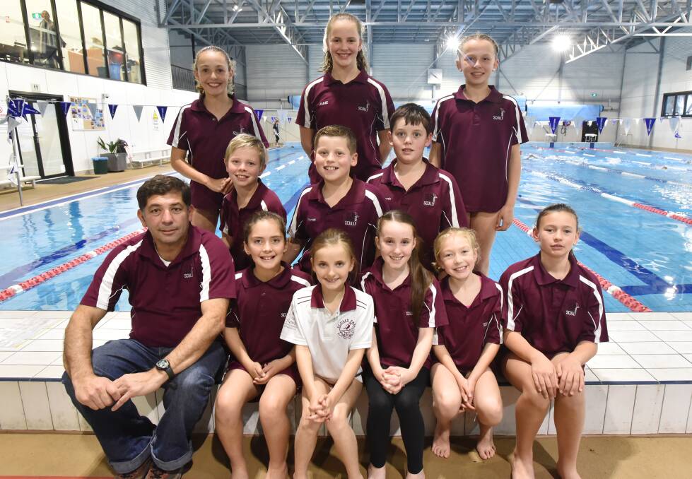 Scully Park had a strong showing at last weekend’s area short course championships. Pictured are their record breakers and age championship placegetters. (Back from left) Courtney Mulligan, Amelia Fauchon, Alexis French, (Middle from left)) Oliver Fauchon, Thomas Duddy, Benjamin Duddy, (Front from left) Pedro Barbosa, Hannah Walmsley, Tilani Smith, Molly Smith, Chloe Mulligan, Grace Edgecock. Photo: Geoff O’Neill 230616GOE01