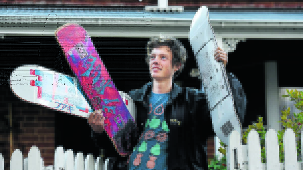 DESIGNING WAYS: Teenage skateboard entrepreneur Reuben Boatwright with some of his designs. Photo: Gareth Gardner 060616GGD03