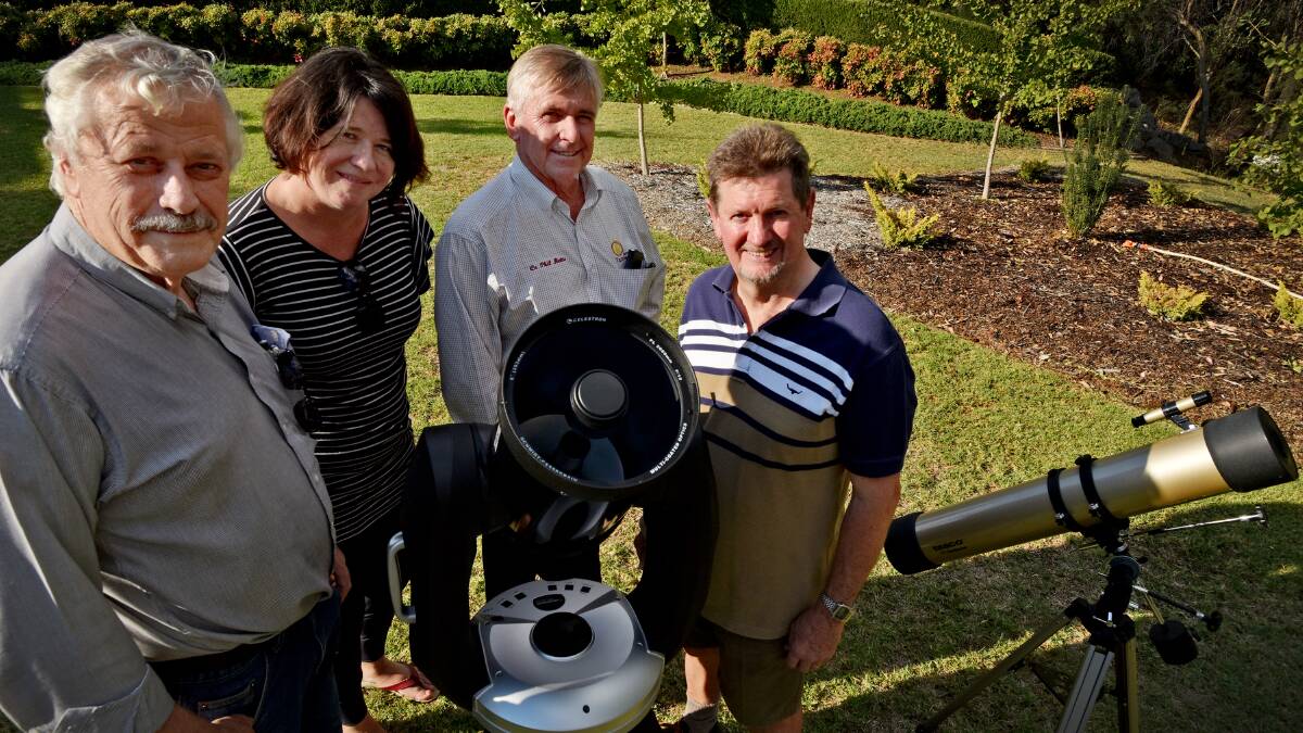 STARS IN THEIR SCOPES: Tamworth Regional Astronomy Club members Garry Copper, Kate Daley, Phil Betts and Steve Rogers see a bright future for astronomy in our region. Photo: Geoff O’Neill 120416GOF02