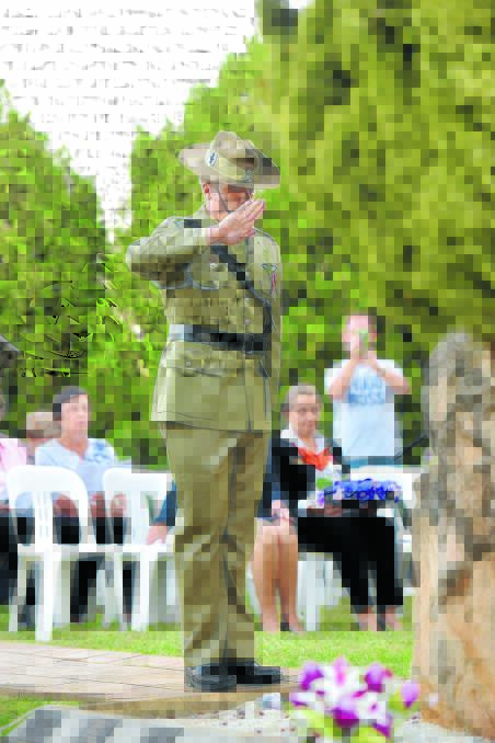 Major Clinton Shiell lays his floral tribute. 210416GOG05