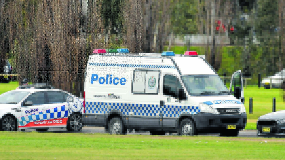 CHARGES PENDING: Western highway patrol officers return positive samples to a police drug detection bus in Tamworth on Monday. Photo: Barry Smith 040716BSE07