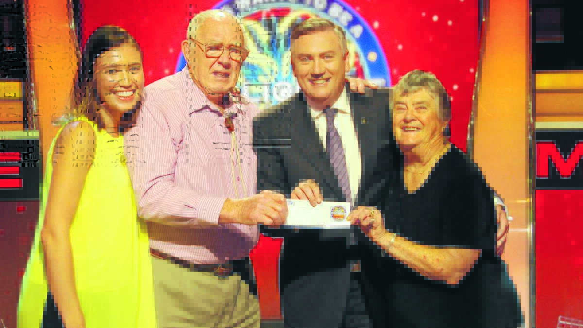 OLDEST WINNER: Anri Forrest, Bill Forrest, host Eddie McGuire and Ruth Forrest with the $20,000 winnings.