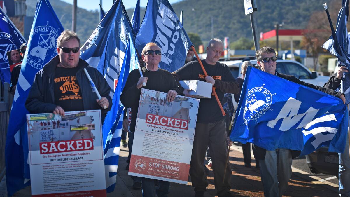 OUT IN FORCE: The meat workers union marches outside Barnaby Joyce’s White St office. Photo: Geoff O’Neill 290616GOC01