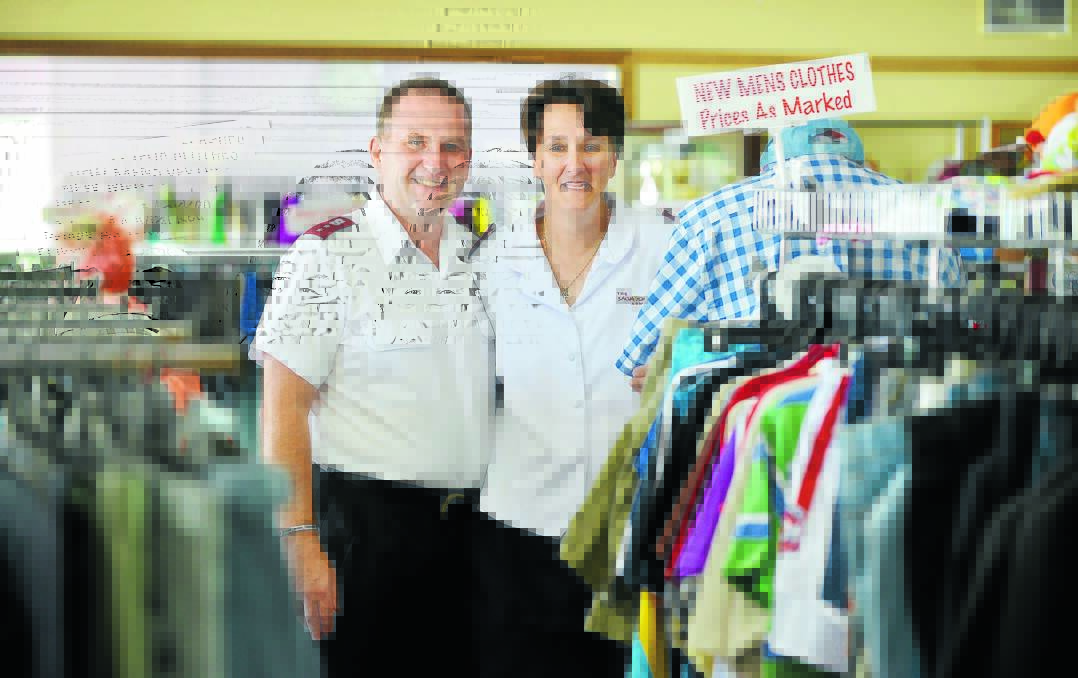 STRAINED LIVING: Salvation Army captains Dean and Rhonda Clutterbuck in the store. Photo: Barry Smith 050216BSF03