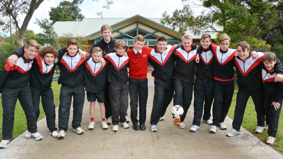 Carinya Christian School football team (from left)  Jared Mason, Harri Baillie, Jack Young, Callum Henry, Joel Carter, Oscar King, Brock Morley, Toby Maslen, Robbie Young, Joel  Schwenke, Jack Weatherall and James Wallace. Charles Bickersteth (coach behind). Absent: Finley Carter, Joshua Tumbridge and Calvin Sproats.  Photo: Barry Smith  240616BSB03
